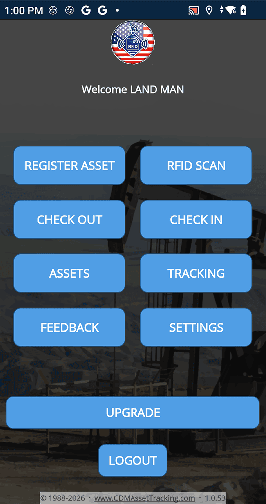 Asset tracking app home screen with a round logo, greeting 'Welcome LAND MAN', and blue action buttons: Register Asset, RFID Scan, Check Out, Check In, Assets, Tracking, Feedback, Settings, Upgrade, and Logout on a dark banner background.